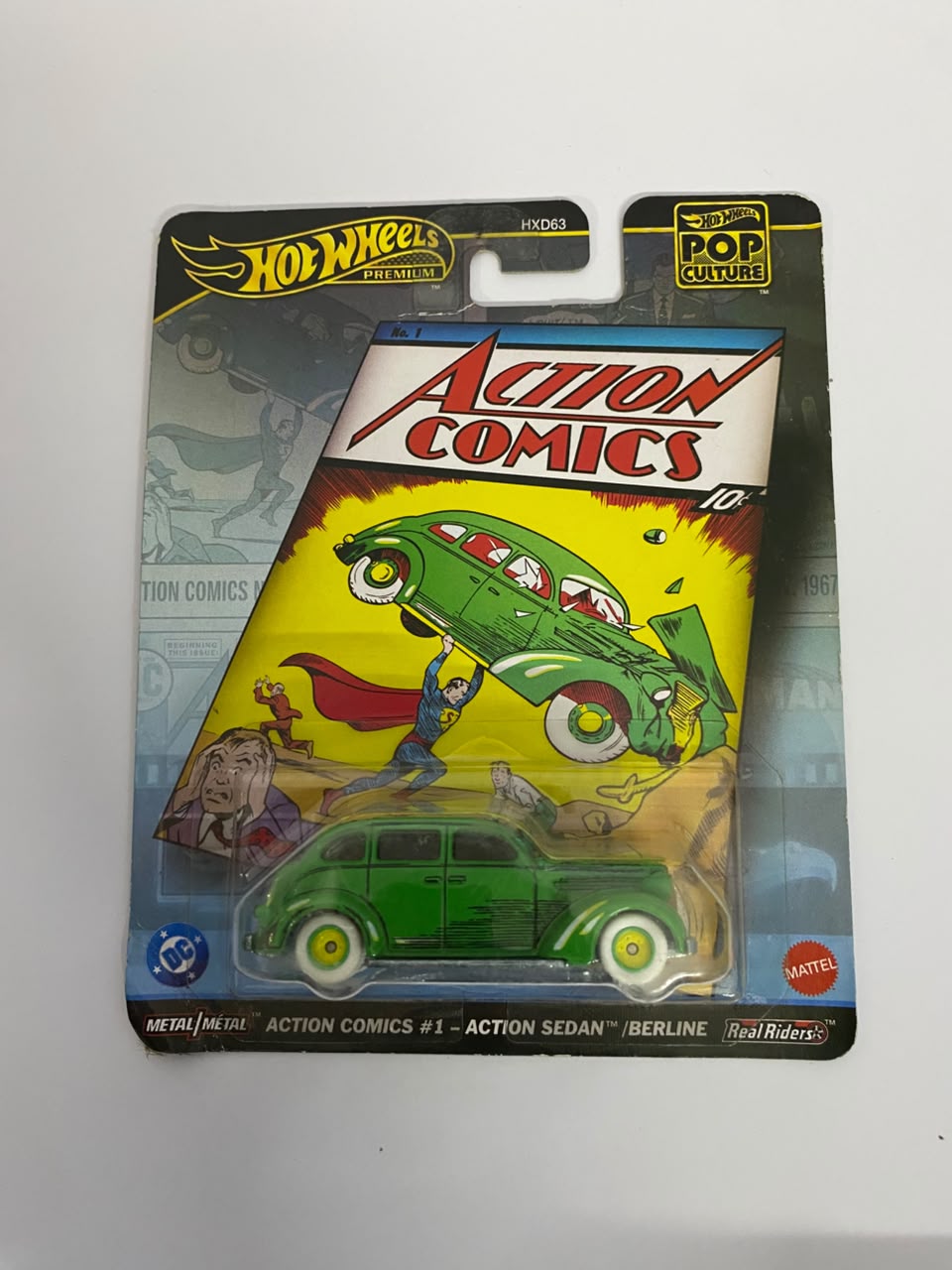 Hot Wheels Premium Pop Culture: DC Action Comics #1 "Action Sedan" – 1:64 Scale Diecast Car (Real Riders)