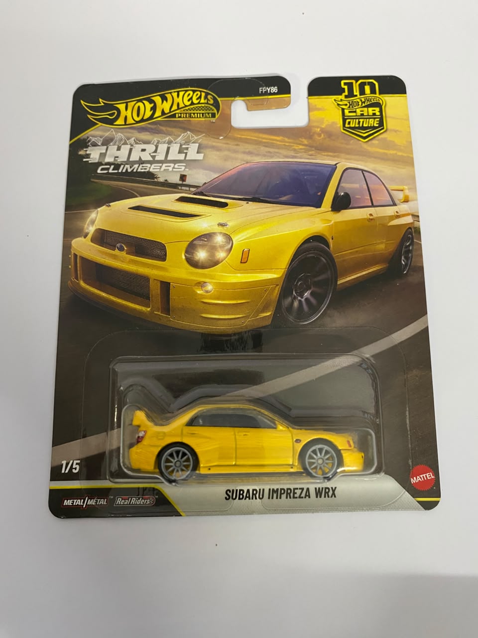 Hot Wheels Premium Car Culture: Thrill Climbers – Subaru Impreza WRX (Yellow) 1:64 Scale Diecast Car (Real Riders)