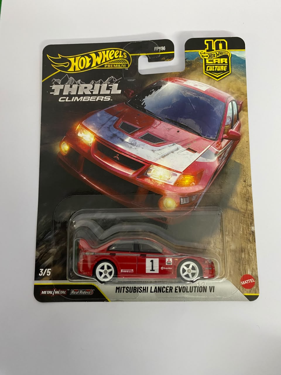 Hot Wheels Premium Car Culture: Thrill Climbers – Mitsubishi Lancer Evolution VI 1:64 Scale Diecast Rally Car (Real Riders)