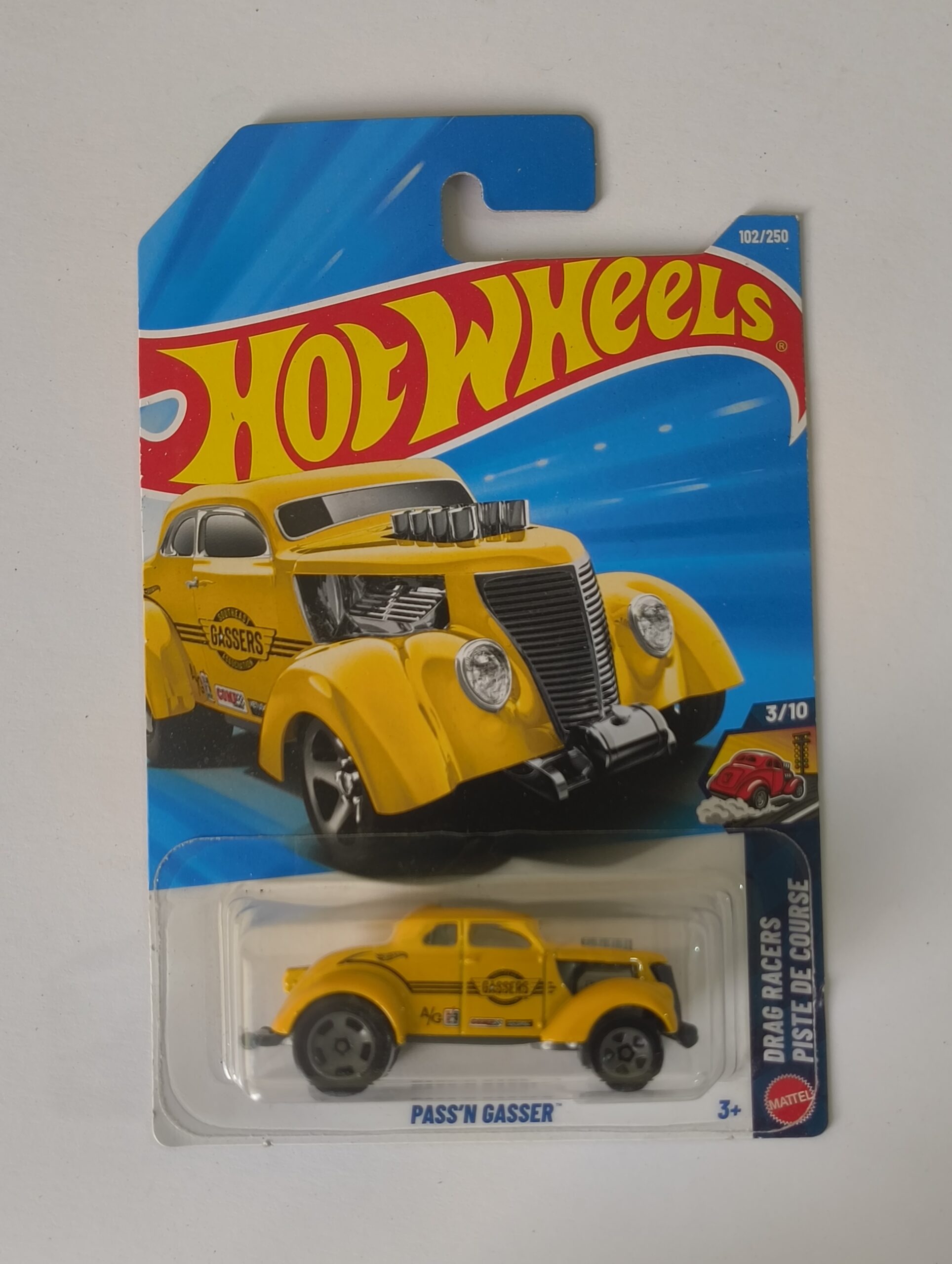 Hot Wheels Passn Gasser die cast front raised stance view Passn Gasser Hot Wheels side profile Classic gasser style drag car miniature close up Hot Wheels Passn Gasser in packaging Vintage drag racing die cast model for collectors