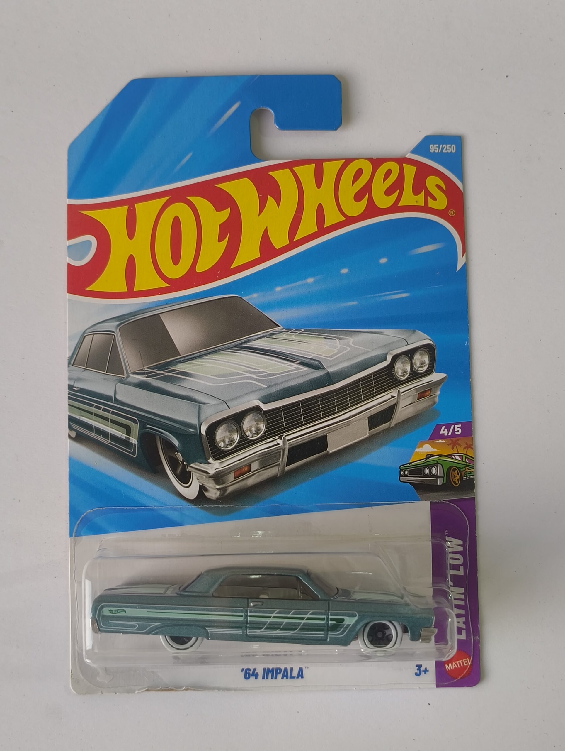 Hot Wheels 64 Impala die cast front angle view 1964 Impala Hot Wheels side profile Classic lowrider style Impala miniature close up Hot Wheels 64 Impala in original packaging American classic 64 Impala die cast collectible